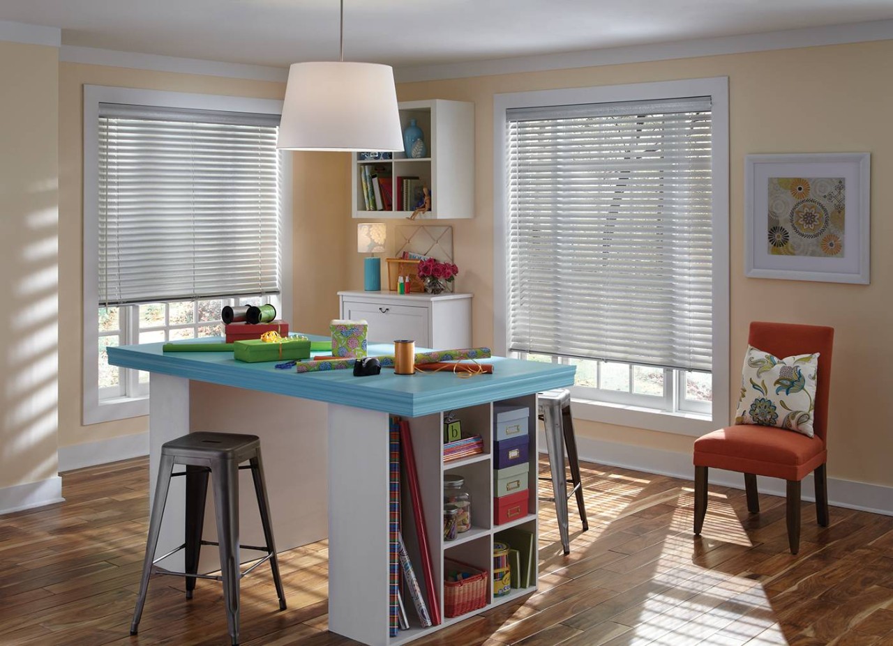 Hunter Douglas Aluminum Blinds filtering sunlight during the day into an office near Tucson, AZ