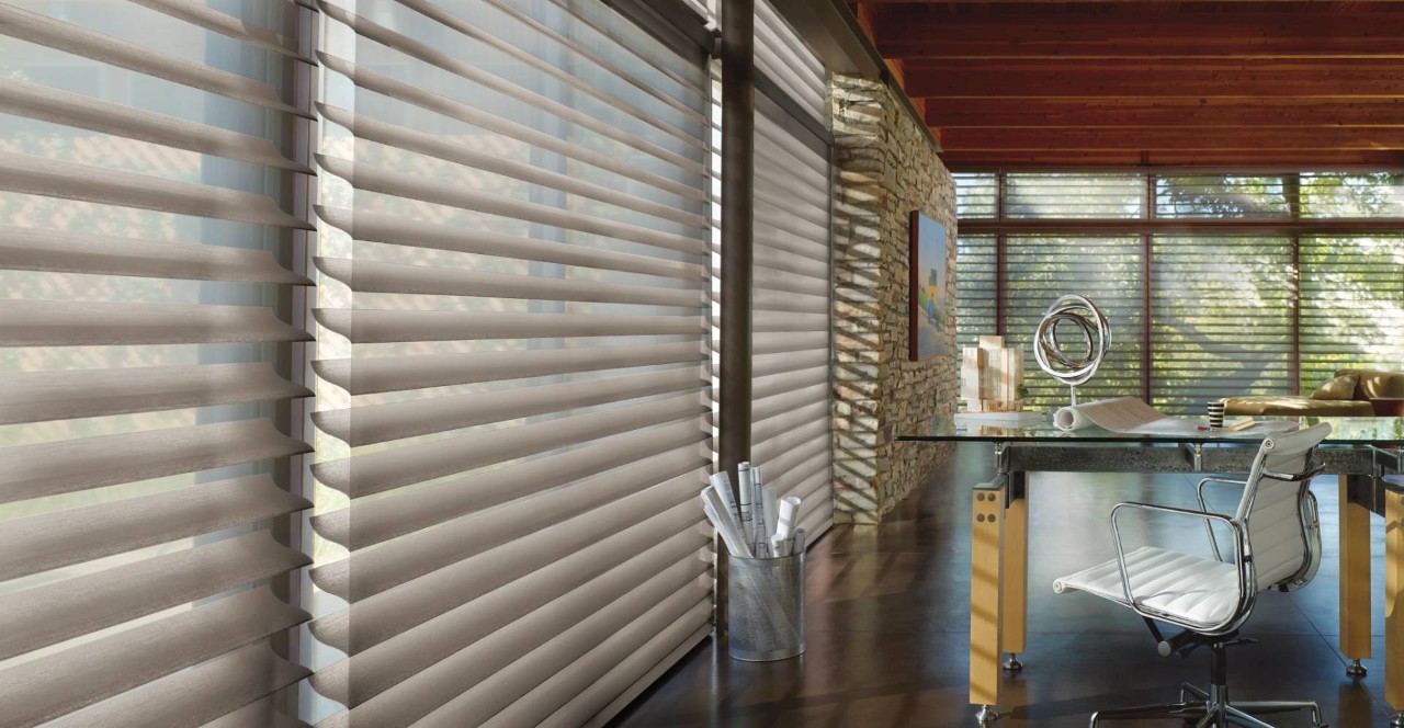 Hunter Douglas Silhouette® Shades filtering light in a home office near Tucson, AZ