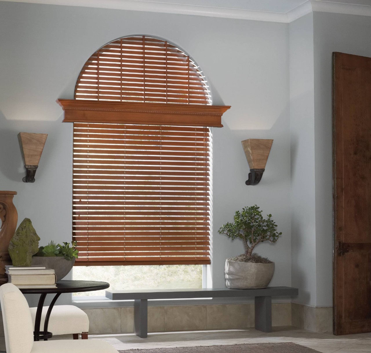 A modern living room with arched window blinds near Tucson, AZ